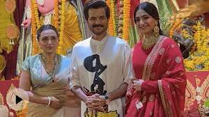 Sonam Kapoor and Anil Kapoor are seen wearing red, heavy jewellery during Durga Puja celebrations with Rani Mukerji.